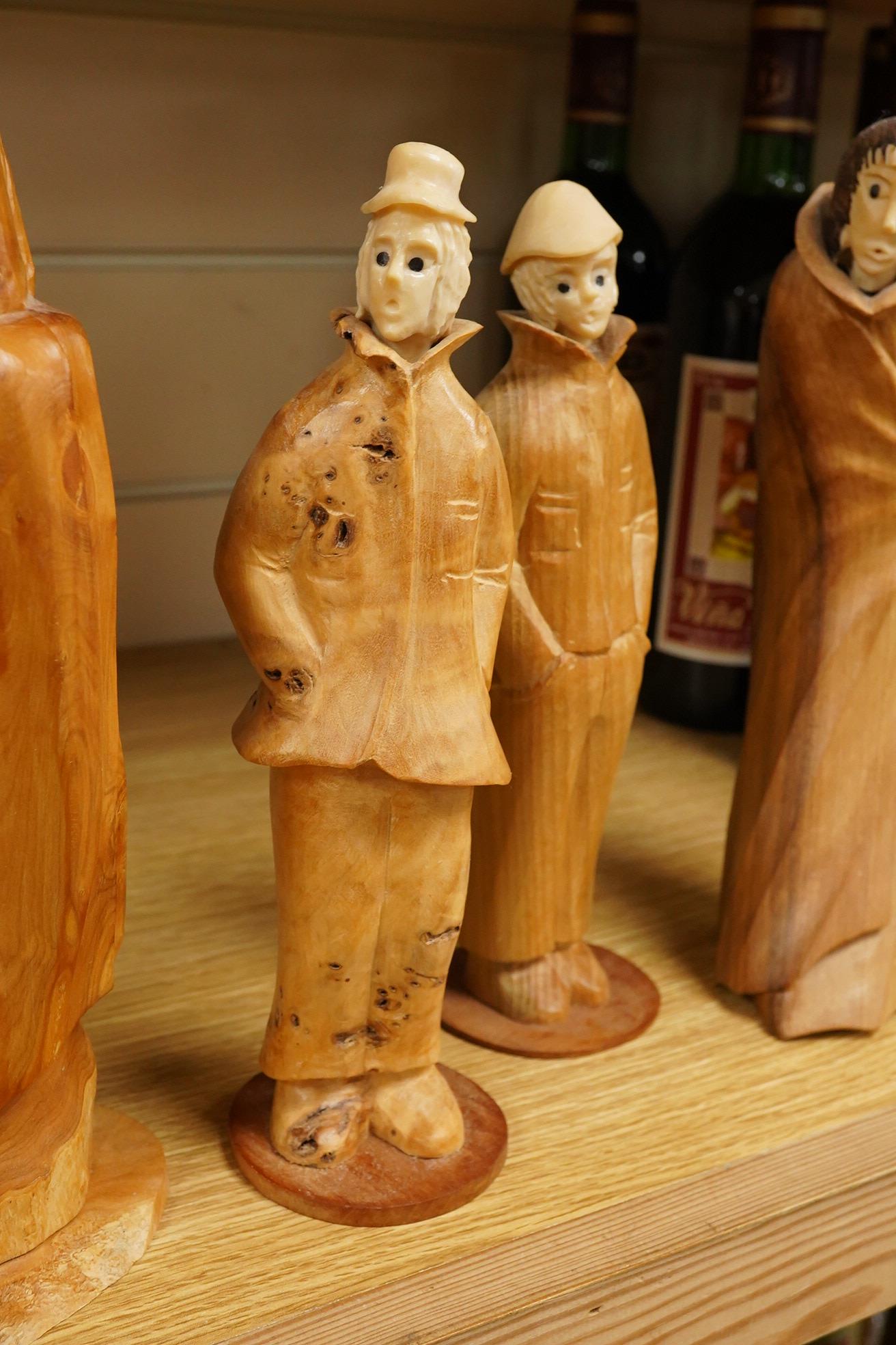 Pierre Decorse (b.1953), a group of four carved figures, tallest 29cm high